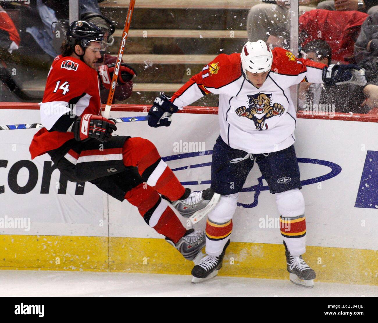 Ottawa Senators Andrej Meszaros (L) collides with Florida Panthers Gregory Campbell during the first period of their NHL hockey game in Ottawa February 7, 2008.       REUTERS/Chris Wattie       (CANADA) Stock Photo