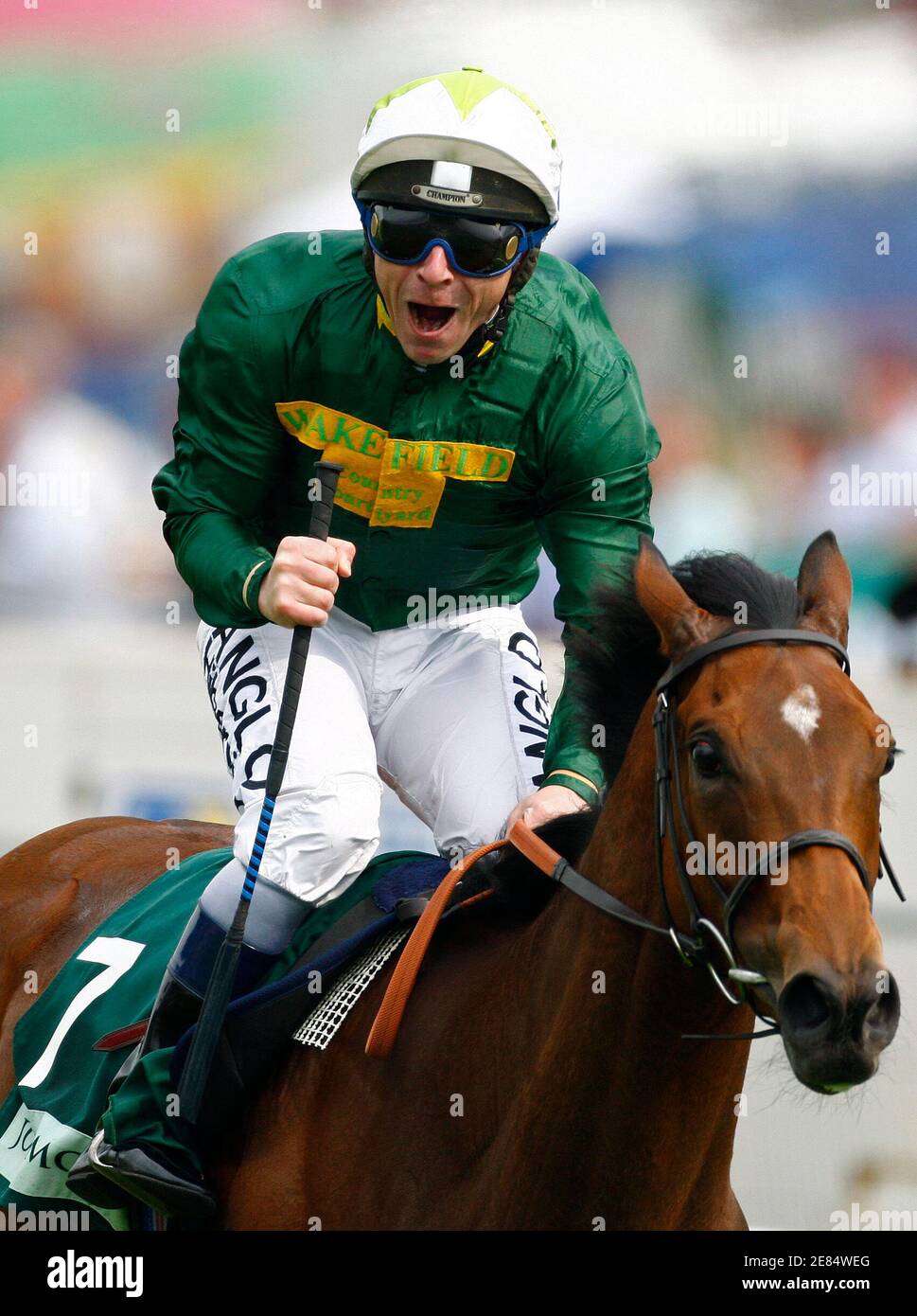 Seb Sanders riding Look Here celebrates as he wins the Oak during the Epsom Derby Festival at Epsom Downs in Surrey, southern England June 6, 2008. REUTERS/Alessia Pierdomenico (BRITAIN) Stock Photo