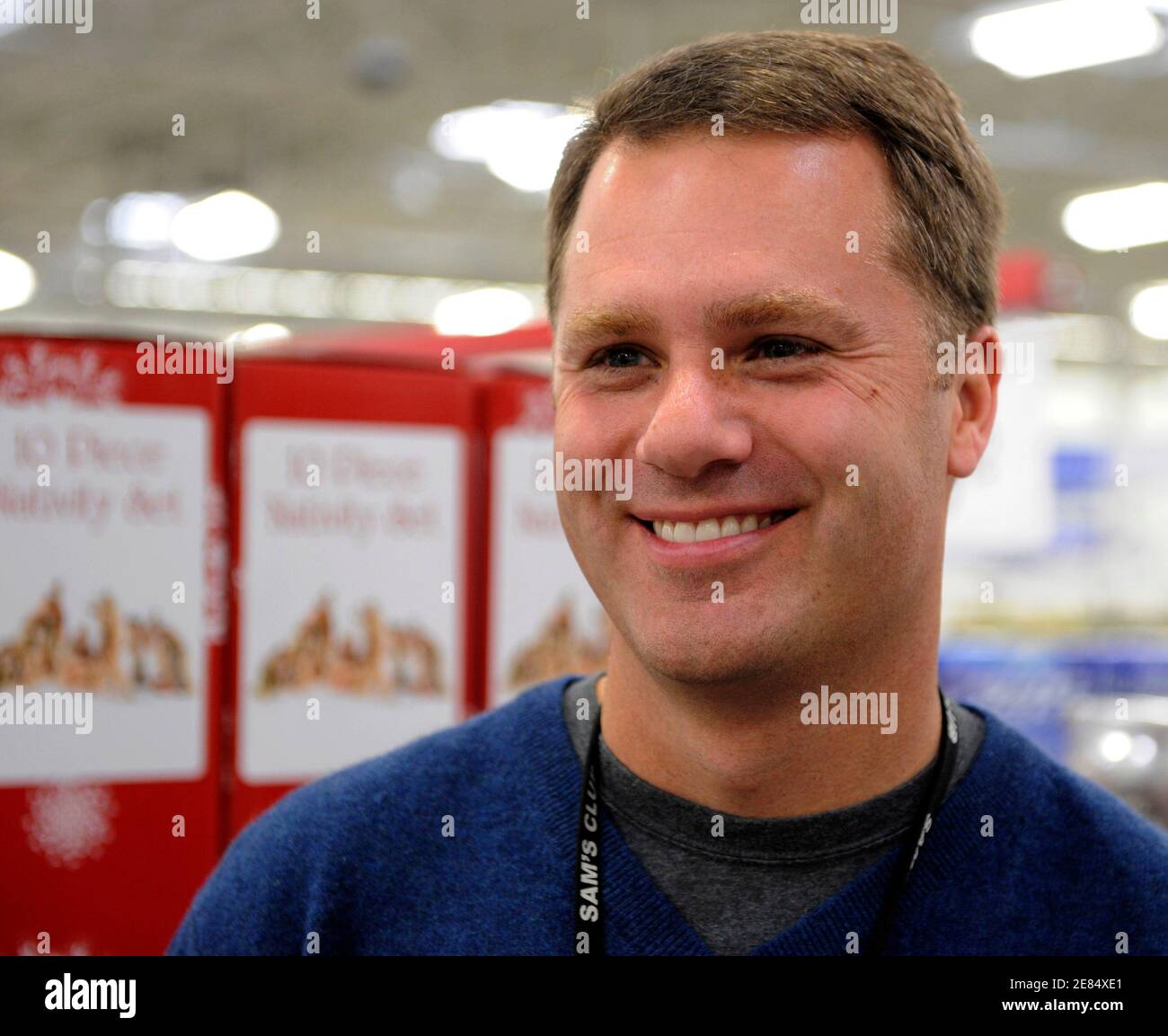 Sam's Club Chief Executive Doug McMillon smiles as he tours the Sam's Club  Store in Secaucus, New Jersey, November 25, 2008. Black Friday sales and  store traffic will rise this year as
