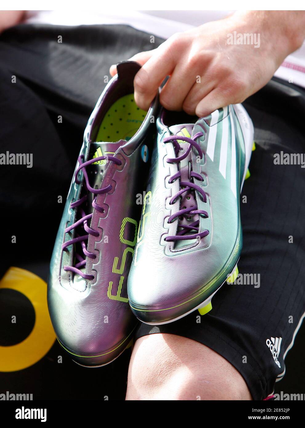Argentina's national soccer team player Lionel Messi displays the new F50  adiZero soccer boots during a promotional event at Montmelo circuit near  Barcelona May 11, 2010. The boots, weighing only 165 grams,