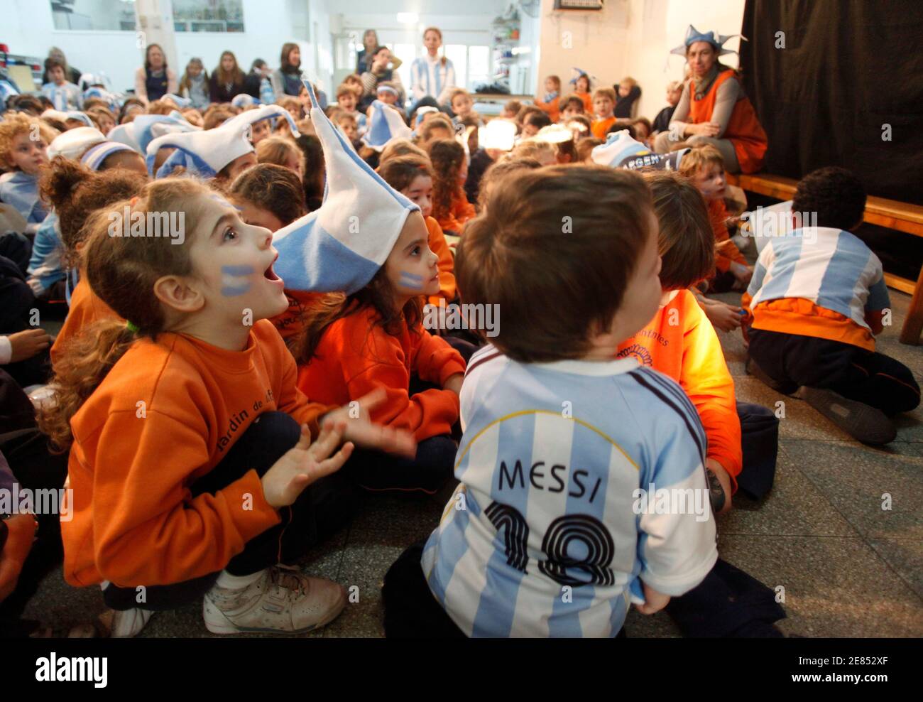 Students watch the World Cup soccer match between Argentina and South Korea on television in their classroom at Jean Piaget Colegio in Buenos Aires June 17, 2010. Argentina's Education Minister Alberto Sileoni authorised all schools across the country to have a television in their classrooms to watch the World Cup matches. REUTERS/Martin Acosta (ARGENTINA - Tags: SPORT SOCCER WORLD CUP) Stock Photo