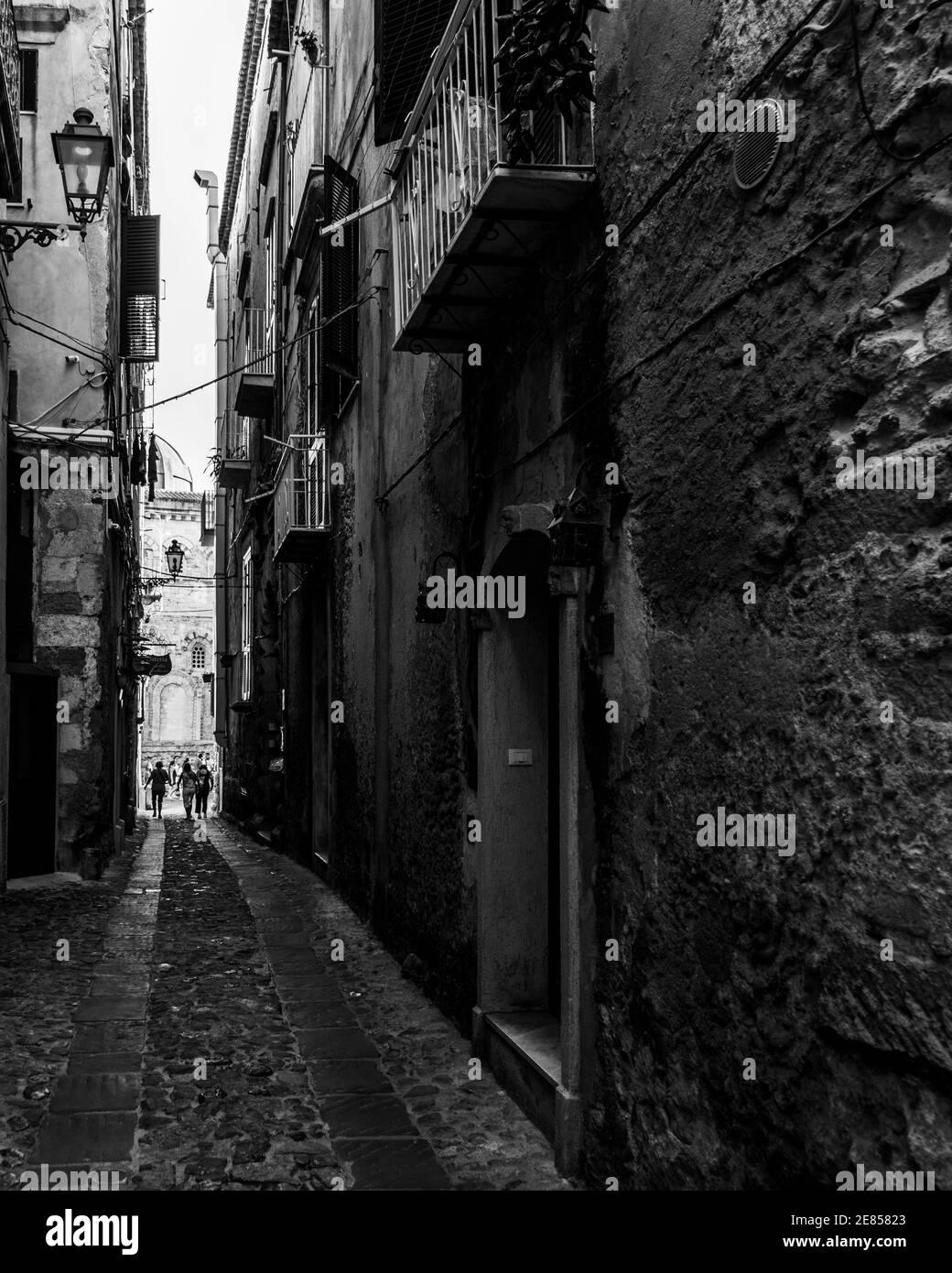 Black and white image of a narrow alley in Tropea historic center, Calabria, Italy Stock Photo