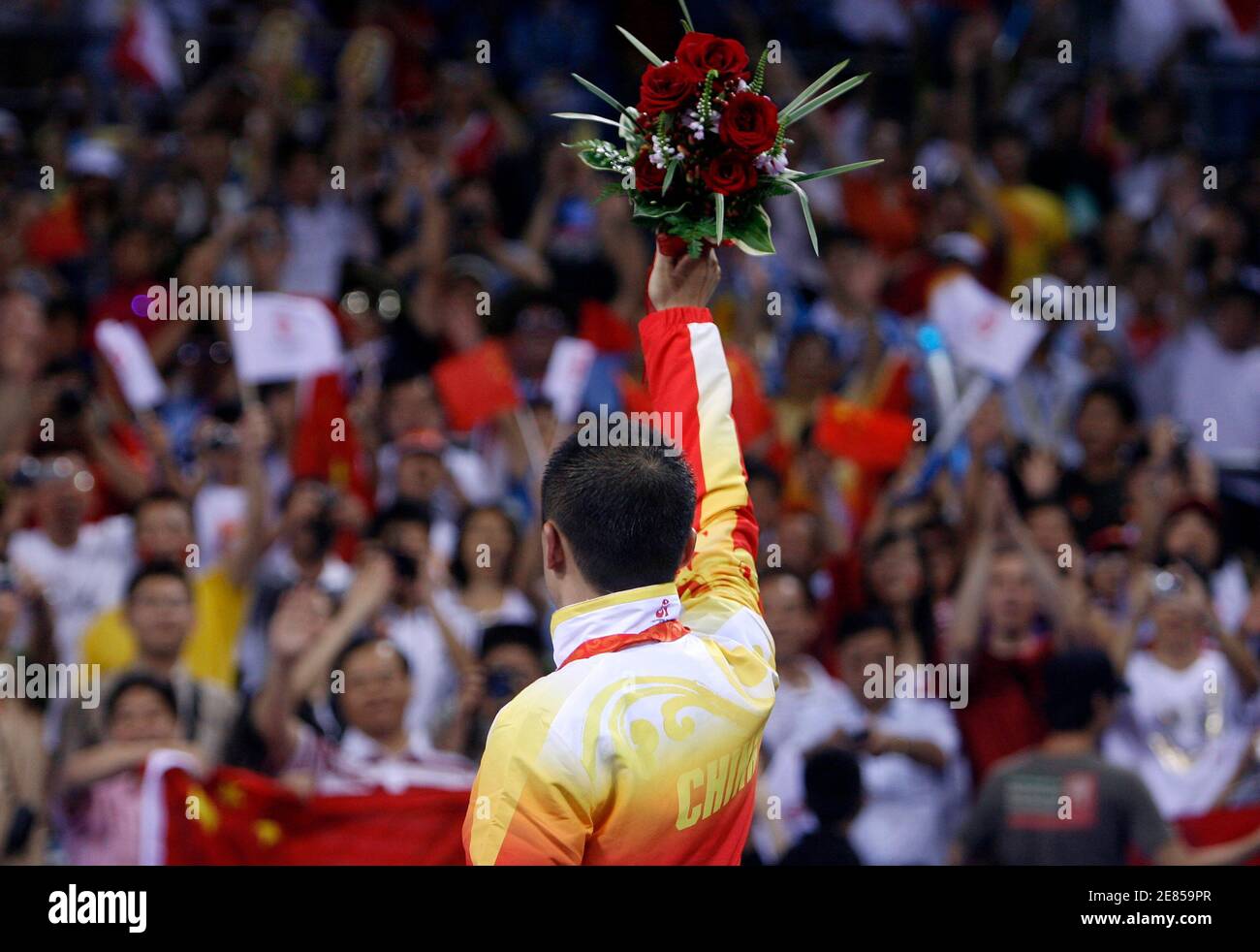 Gold medallist Ma Lin of China celebrates on the podium after the men's singles table tennis competition at the Beijing 2008 Olympic Games August 23, 2008.     REUTERS/Beawiharta (CHINA) Stock Photo