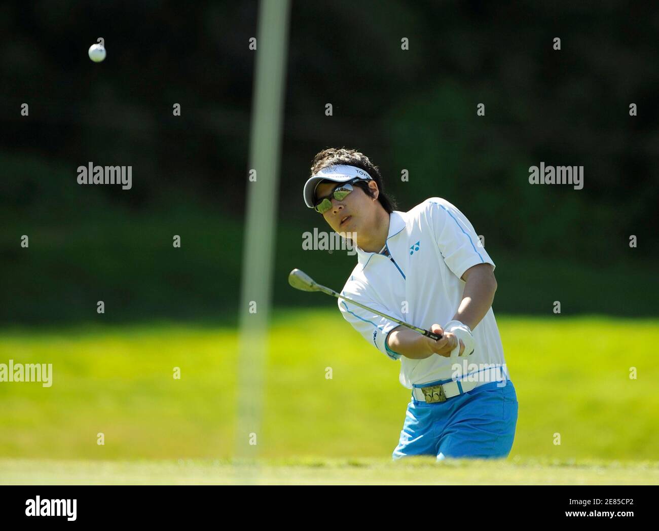 Golfer Ryo Ishikawa, 17, of Japan, chips from the fringe on the sixth hole during the first round of the Northern Trust Open golf tournament in the Pacific Palisades area of Los Angeles February 19, 2009. REUTERS/Gus Ruelas (UNITED STATES) Stock Photo