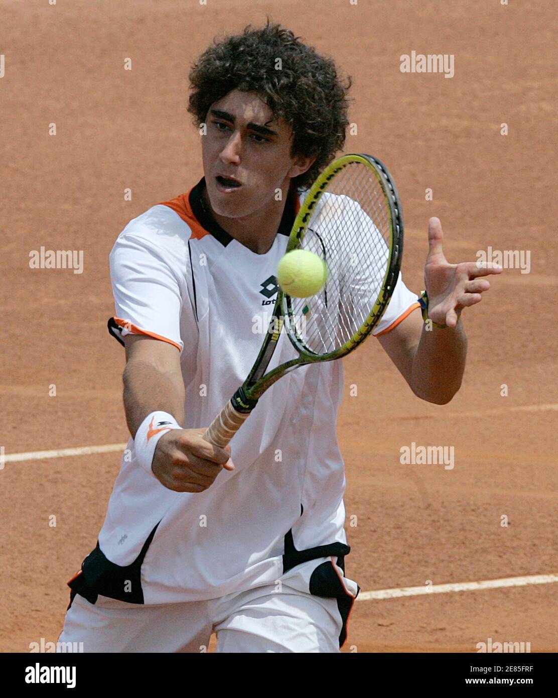 Argentina's Facundo Arguello hits a return to compatriot Agustin Velotti in  their Tennis final match at the South American Games in Medellin March 28,  2010. REUTERS/Albeiro Lopera (COLOMBIA - Tags: SPORT TENNIS