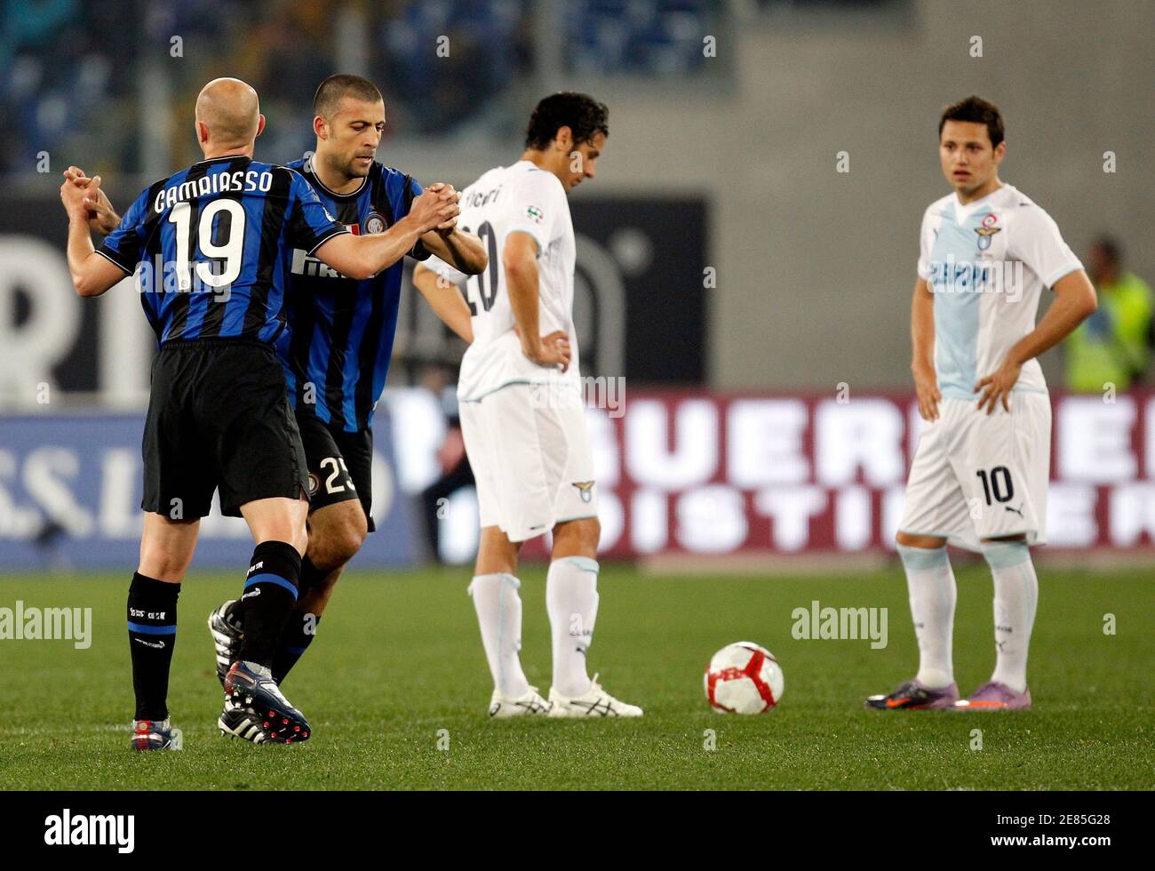 Inter Milan's Walter Samuel (2nd L) celebrates with teammate Esteban  Cambiasso (L) after scoring as Lazio's Sergio Floccari and Mauro Zarate (R)  watch during their Italian Serie A soccer match at the