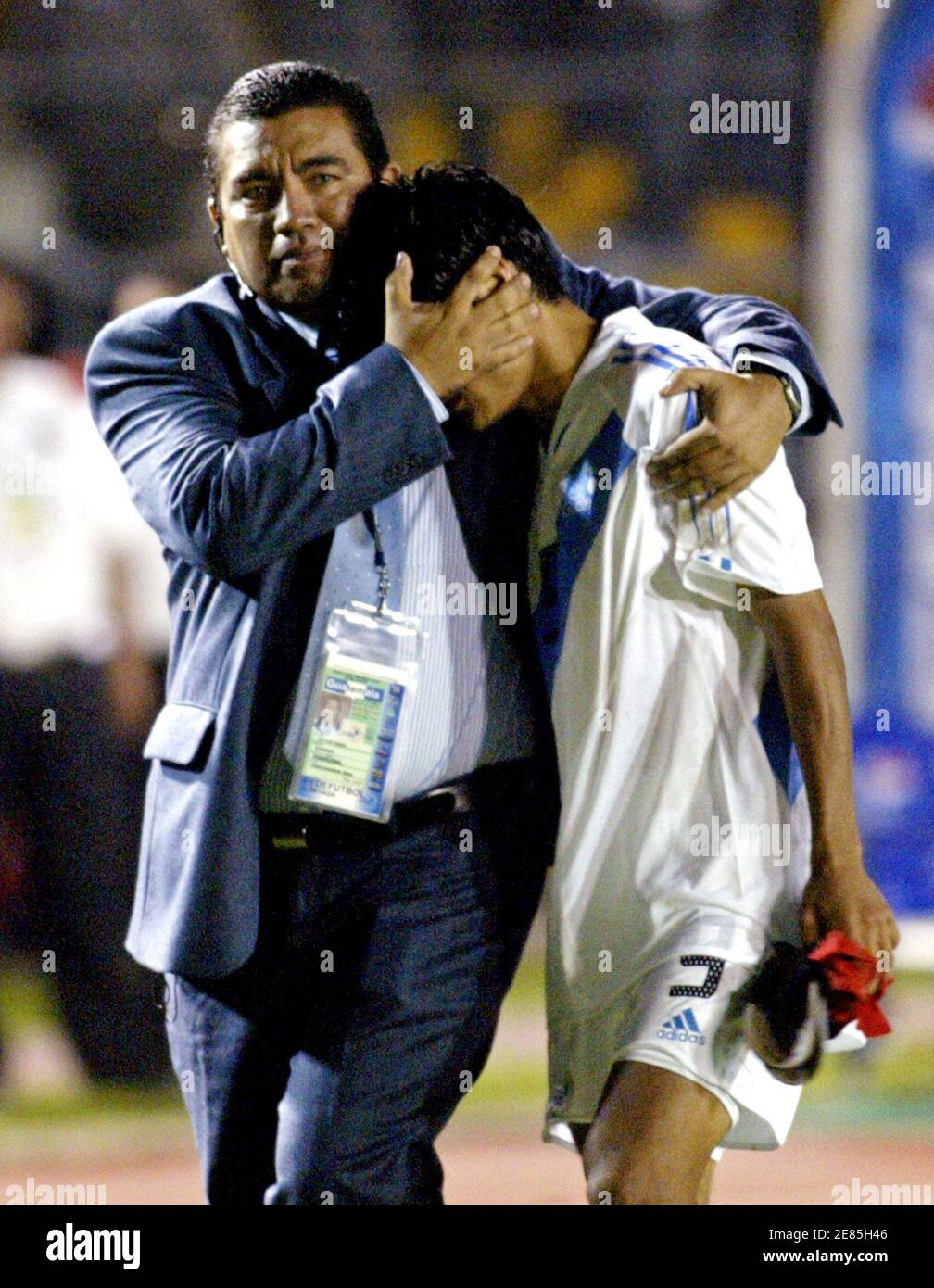 Guatemalan player Freddy Garcia is comforted by a member of the technical team at the end of their 2006 World Cup qualifying soccer match against Costa Rica at Mateo Flores stadium in Guatemalan player Freddy Garcia is comforted by a member of the technical team at the end of their 2006 World Cup qualifying soccer match against Costa Rica at Mateo Flores stadium in