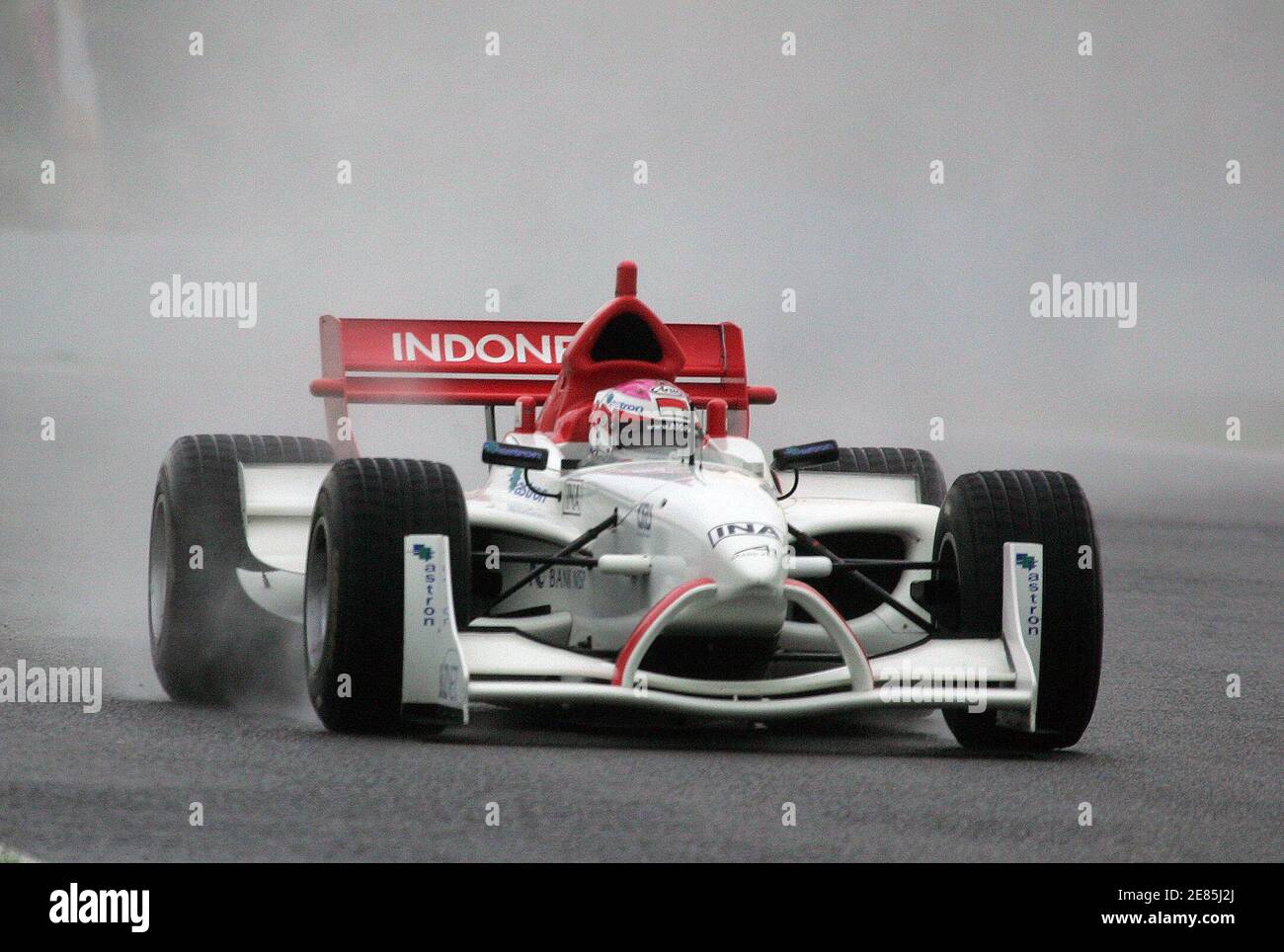 Indonesia A1 driver Ananda Mikola drives his car on the wet track during the official practice session of the A1 Grand Prix Championship at the Sentul circuit in Bogor, West Java province, February 10, 2006. Malaysian driver Alex Yoong recorded the fastest speed during the practice session on a wet track in heavy rain. REUTERS/Beawiharta Stock Photo