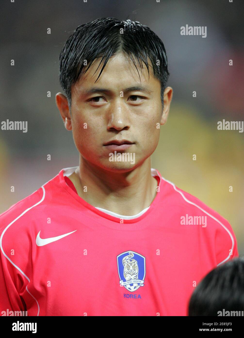 South Korea national soccer team player Lee Young-Pyo listens to the  national anthem before a