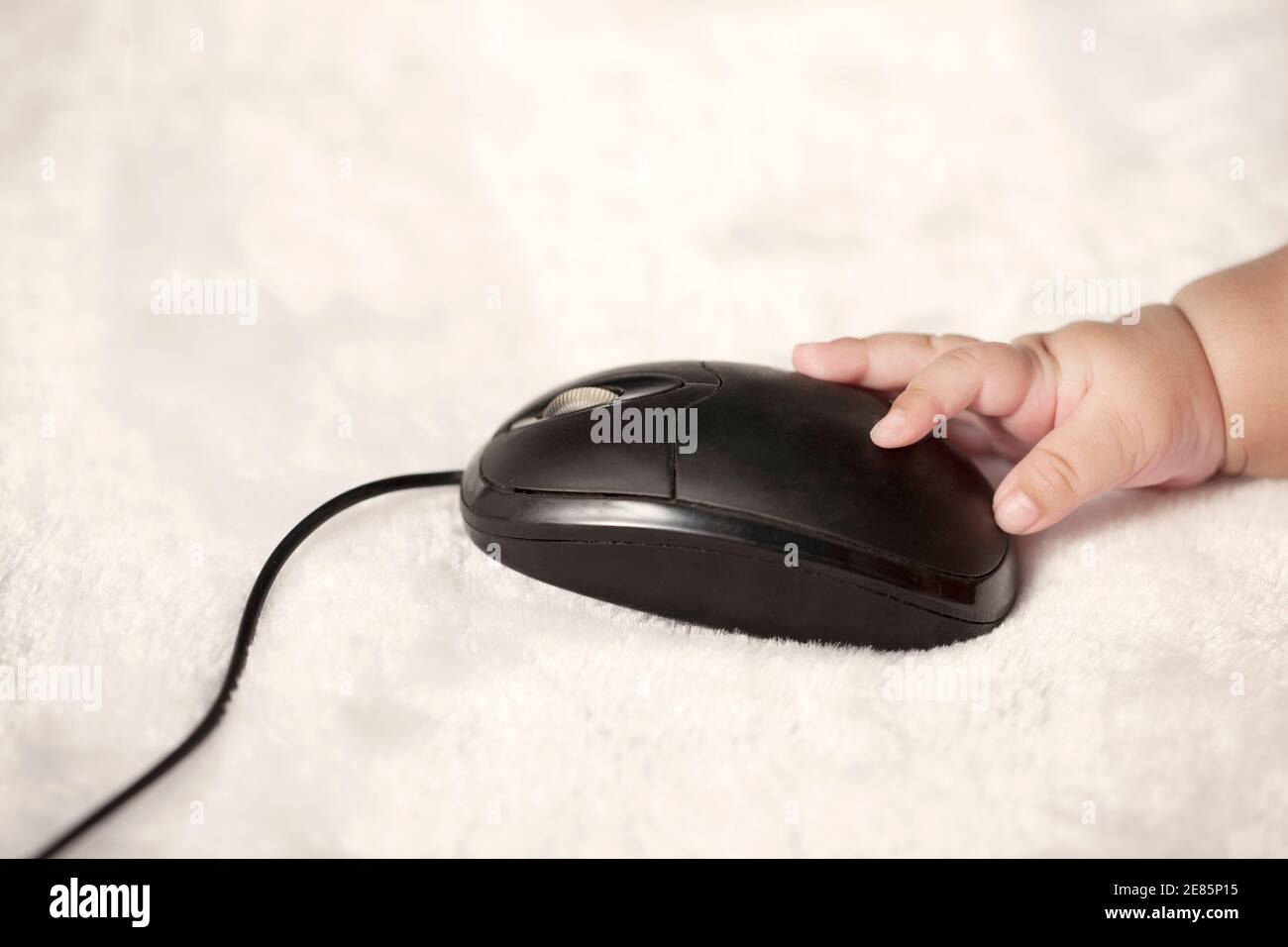 Baby touching computer mouse high quality photo Stock Photo - Alamy