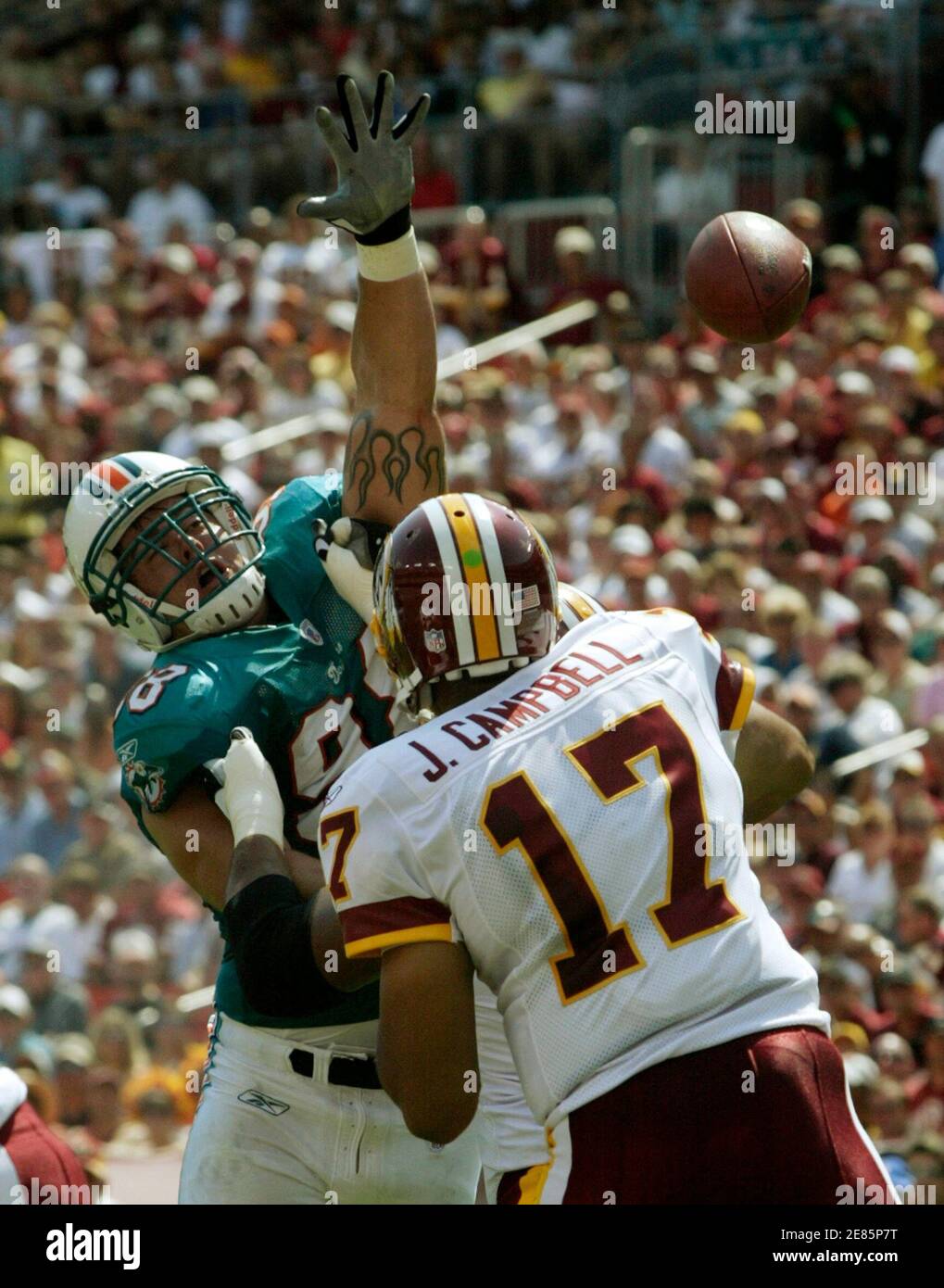 Washington Redskins quarterback Jason Campbell (17) throws against the pass rush of Miami Dolphins defensive end Matt Roth in the first half of their NFL football game in Landover, Maryland, September 9, 2007.    REUTERS/Gary Cameron  (UNITED STATES) Stock Photo