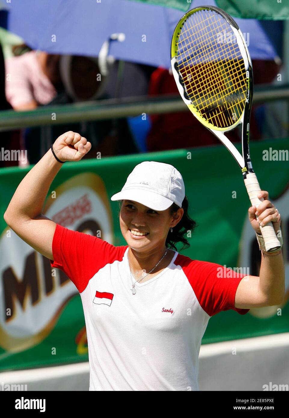 Indonesia'a Sandy Gumulya cerebrates after defeating Thailand's Nudnida  Luangnam during the tennis women's singles final match at the SEA Games in  Nakhon Ratchasima December 14, 2007. Sandy won to take the gold.