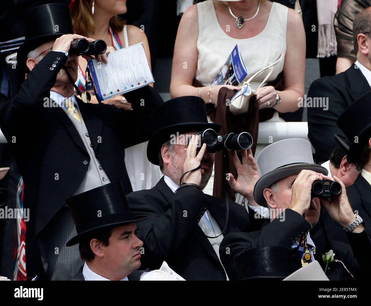 People watch the first race during the Epsom Derby Festival at Epsom Downs in Surrey, southern England, June 7, 2008.    REUTERS/Darren Staples   (BRITAIN) Stock Photo
