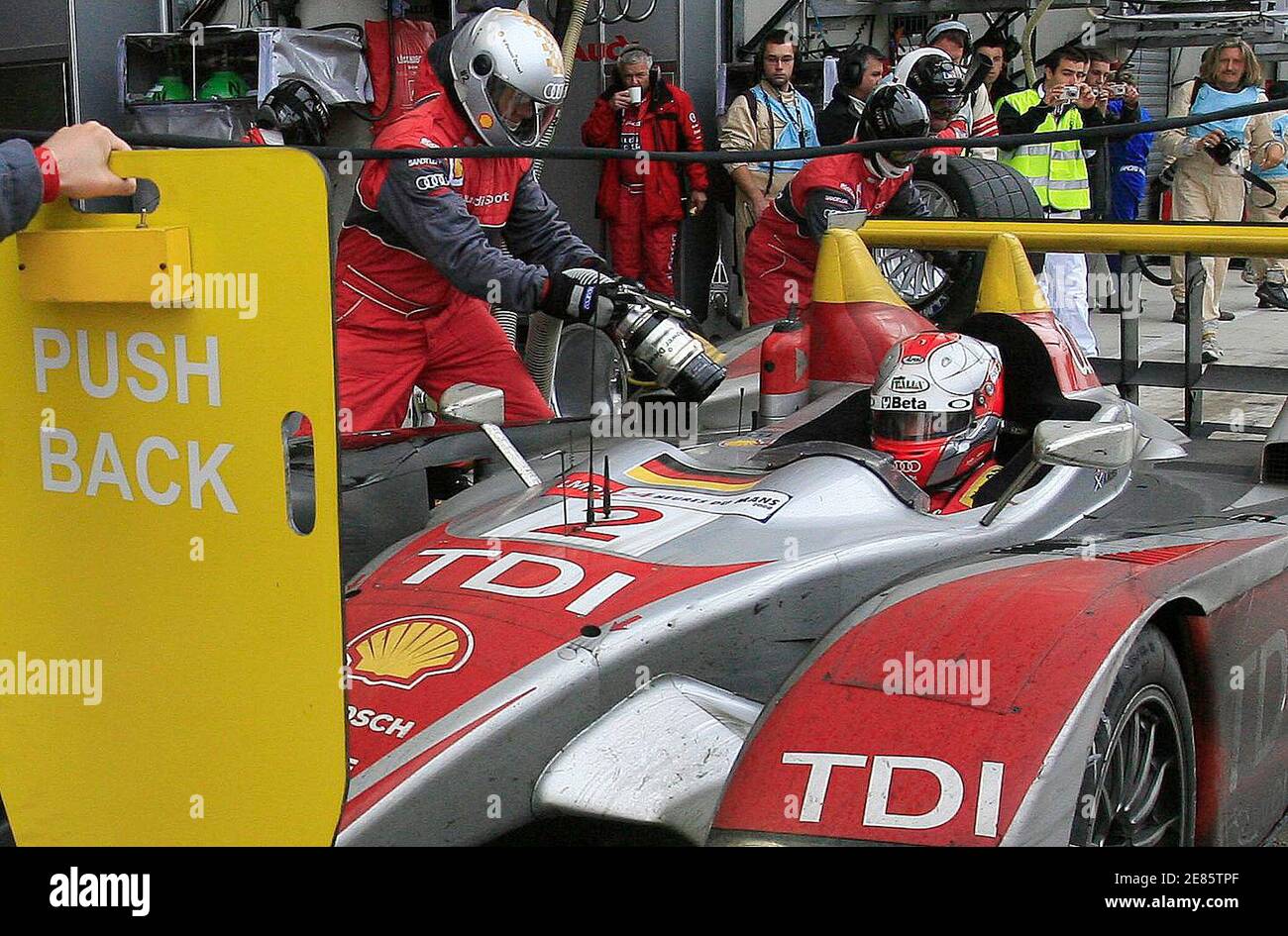 Italy's Rinaldo Capello waits in his Audi R10 number 2 during a stop on the stand as he competes in first position during the Mans 24-hour sportscar endurance race in Le