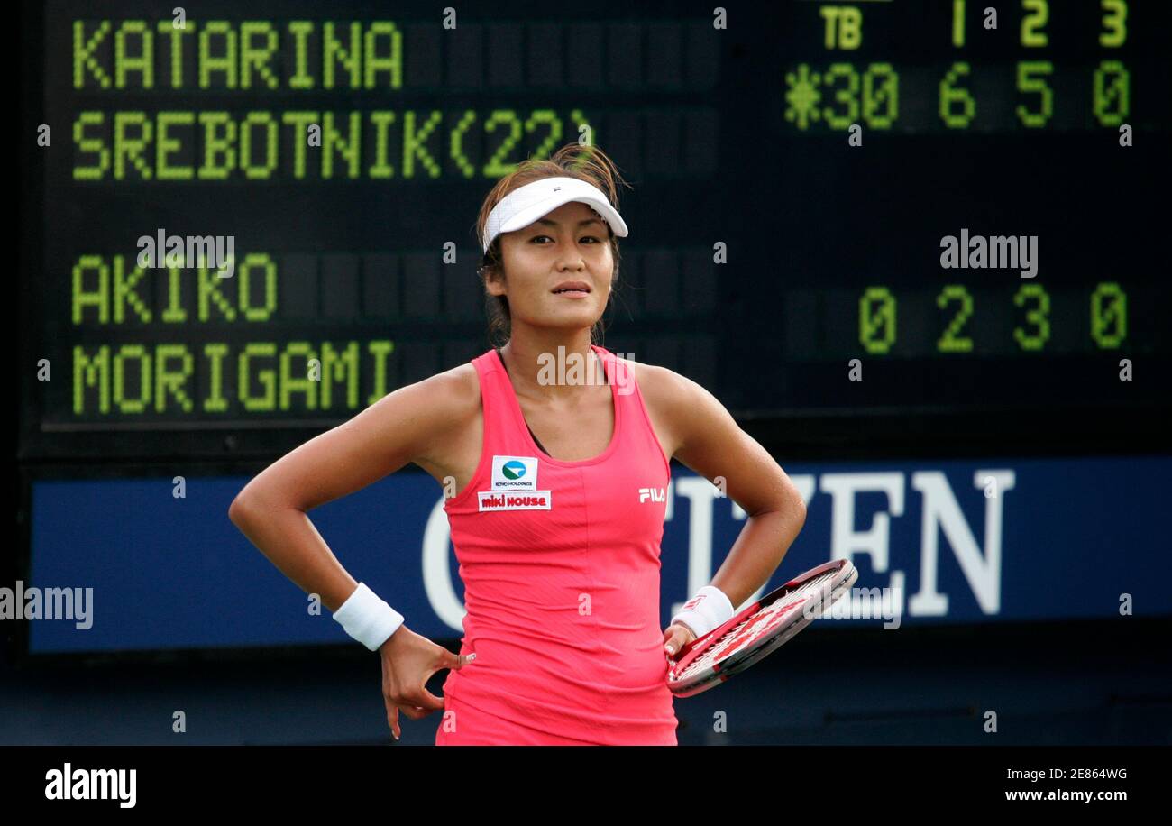 Japan's Akiko Morigami reacts after missing a point against Slovenia's Katarina Srebotnik during their match at the U.S. Open tennis tournament in New York August 28, 2006.    REUTERS/Shaun Best   (UNITED STATES) Stock Photo