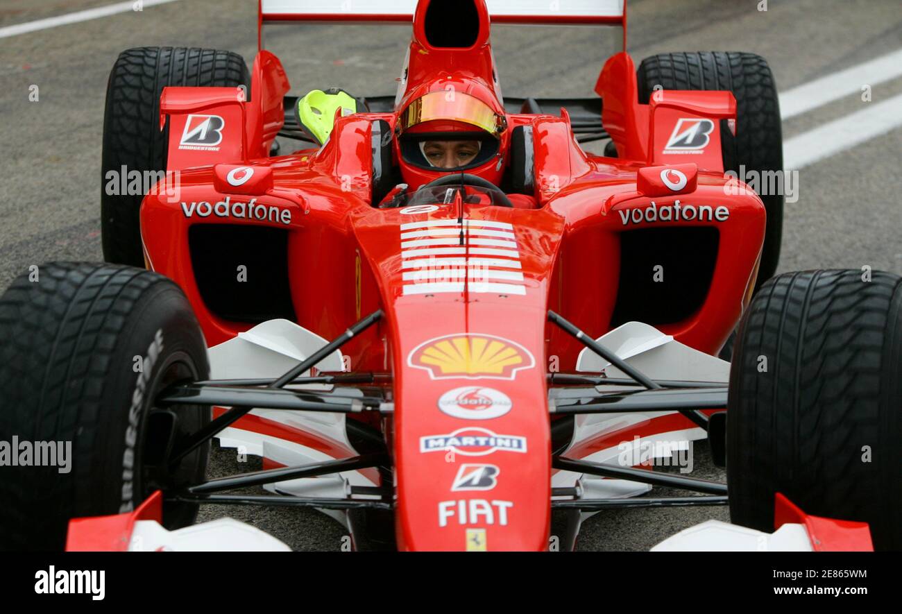 Motorcycling world champion Valentino Rossi of Italy drives a Ferrari  Formula One car during a training session at the Ricardo Tormo race track  in Cheste, near Valencia, Spain January 31, 2006. Rossi