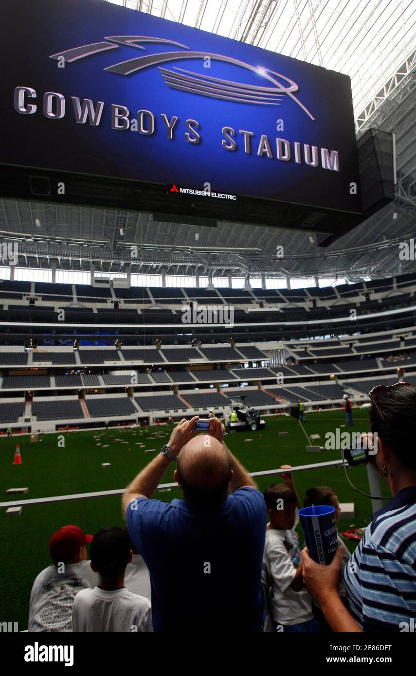 Carlos Narvaez Of Mexico City Takes A Picture Of The High Definition Score Board Hanging Over The Playing Field At Cowboys Stadium The New Home Of Nfl Football Club The Dallas Cowboys