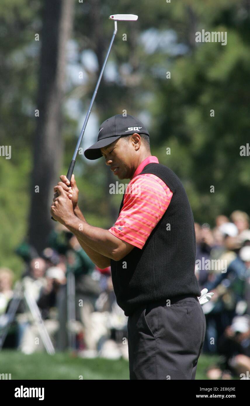 Tiger Woods of the U.S. reacts after missing a putt on the second green during the final round at The Players Championship golf tournament in Ponte Vedra Beach, Florida March 26, 2006. REUTERS/Rick Fowler Stock Photo
