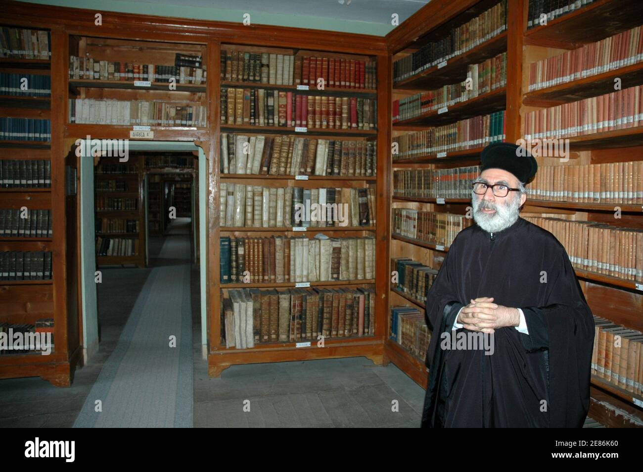 Father Dorotheos, the vice-abbot of the monastery and head of the library, stands in the seminary library in Heybeliada September 18, 2006. The blackboards are clean, desks dusted and library books neatly ranged. The Greek Orthodox seminary on this idyllic island off Istanbul is ready and waiting to take in new student priests. Picture taken on September 18, 2006. To match feature RELIGION TURKEY SEMINARY  REUTERS/Tom Heneghan (TURKEY) Stock Photo