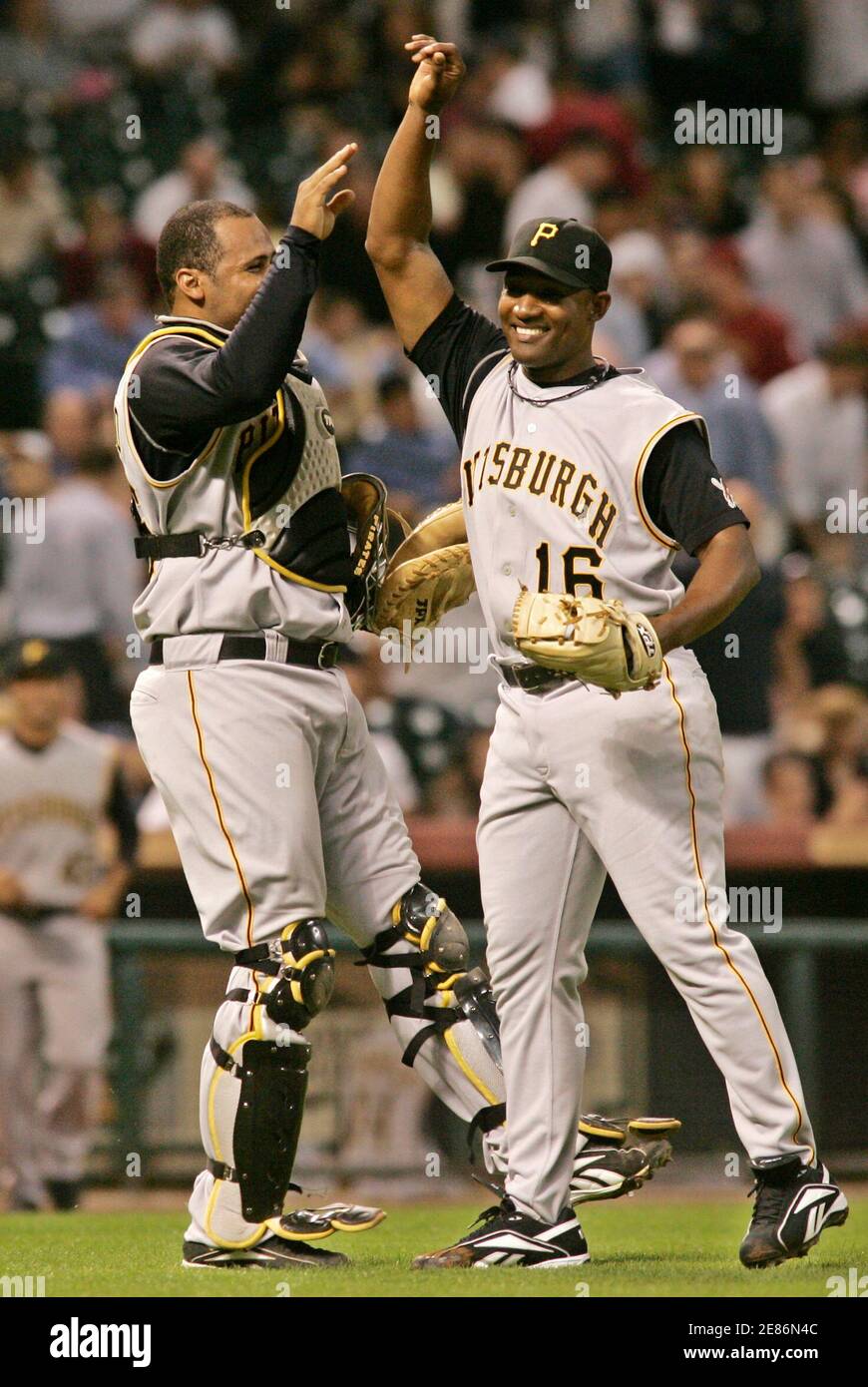 Pittsburgh Pirates pitcher Salomon Torres (R) celebrates with catcher Ronny  Paulino after the Pirates' 4-2 win over the Houston Astros in the tenth  inning of their season opening National League baseball game