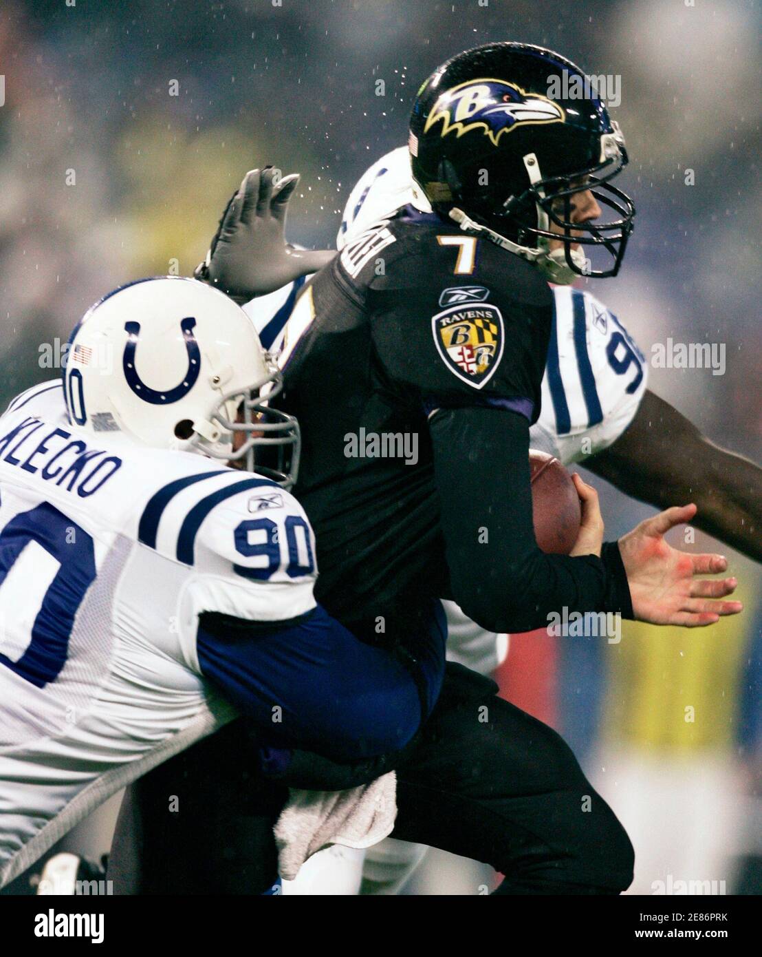 Indianapolis Colts defensive tackle Dan Klecko (90) and teammate Robert Mathis combine to sack Baltimore Ravens quarterback Kyle Boller (7) during the second quarter of their NFL football game in Baltimore, Maryland, December 9, 2007.     REUTERS/Gary Cameron     (UNITED STATES) Stock Photo