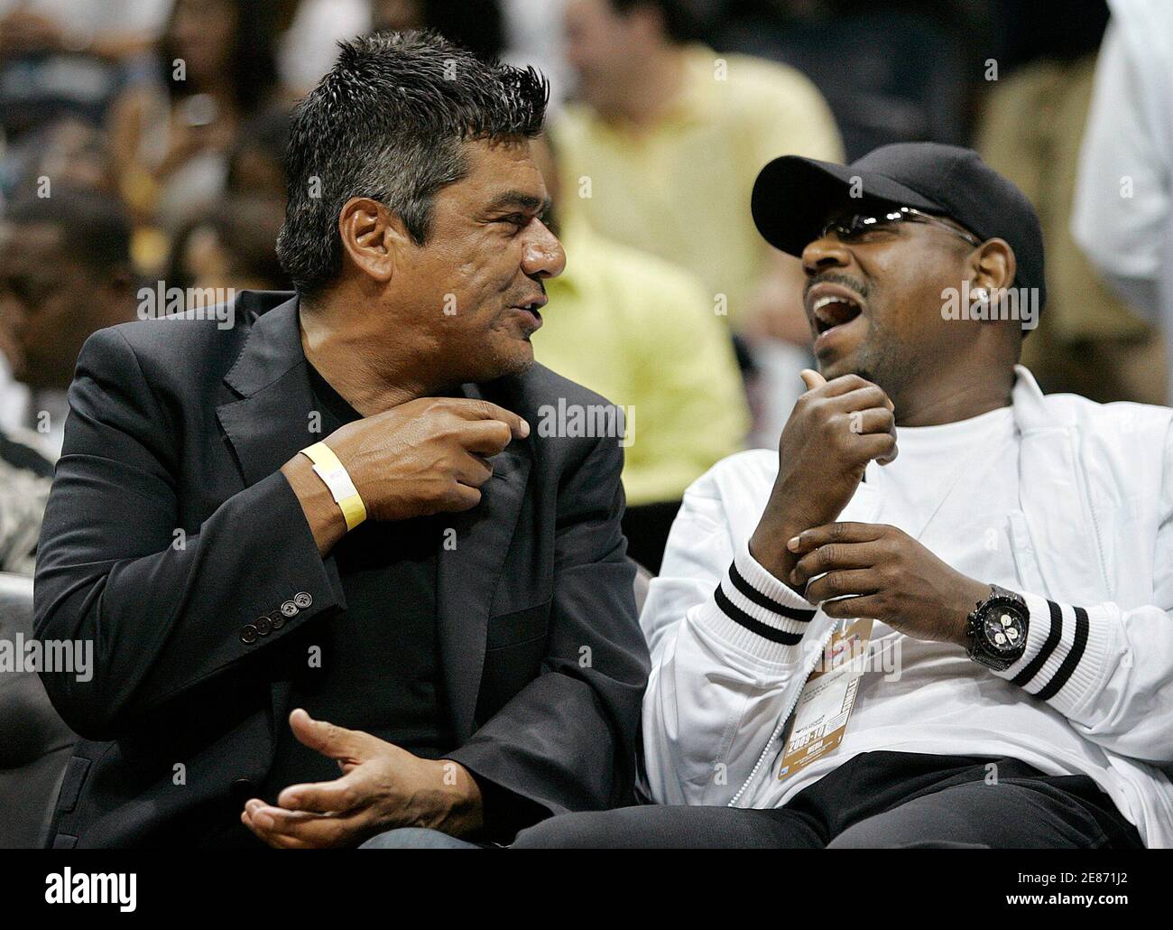 Comedians George Lopez (L) and Martin Lawrence chat during Game 5 of their  NBA Eastern Conference basketball playoff series between the Atlanta Hawks  and the Milwaukee Bucks in Atlanta, Georgia, April 28,