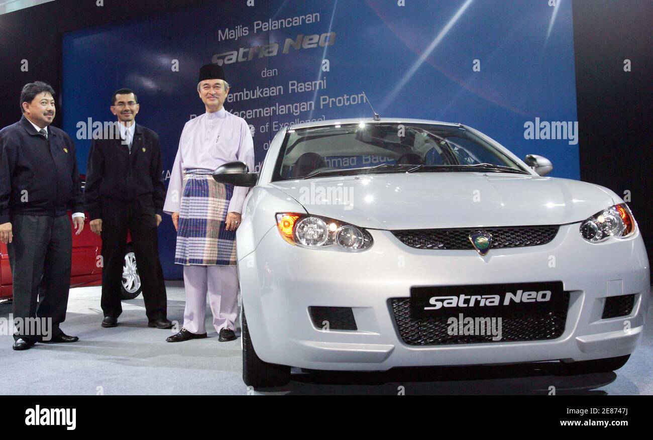 Malaysian Prime Minister Abdullah Ahmad Badawi R Proton S Chairman Mohammed Azlan Hashim L And Managing Director Syed Zainal Abidin Syed Mohamed Tahir Present Proton S New Model Satria Neo At The Proton Headquarters