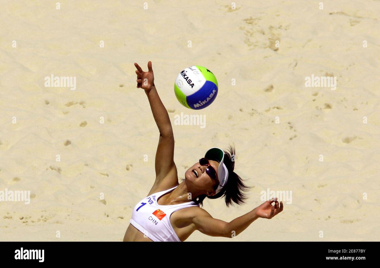 China's Sun Bing reaches for the ball during a preliminary match against  China at a test event for the Olympic venue Chaoyang Park Beach Volleyball  Ground in Beijing August 13, 2007. A