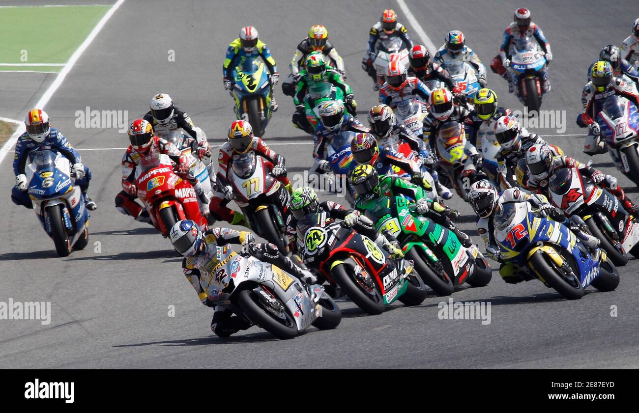 Moto2 riders negotiate a turn before a pile-up at the start of the Moto2  race during the Catalunya Grand Prix in Montnelo , near Barcelona, July 4,  2010. The Moto2 event was