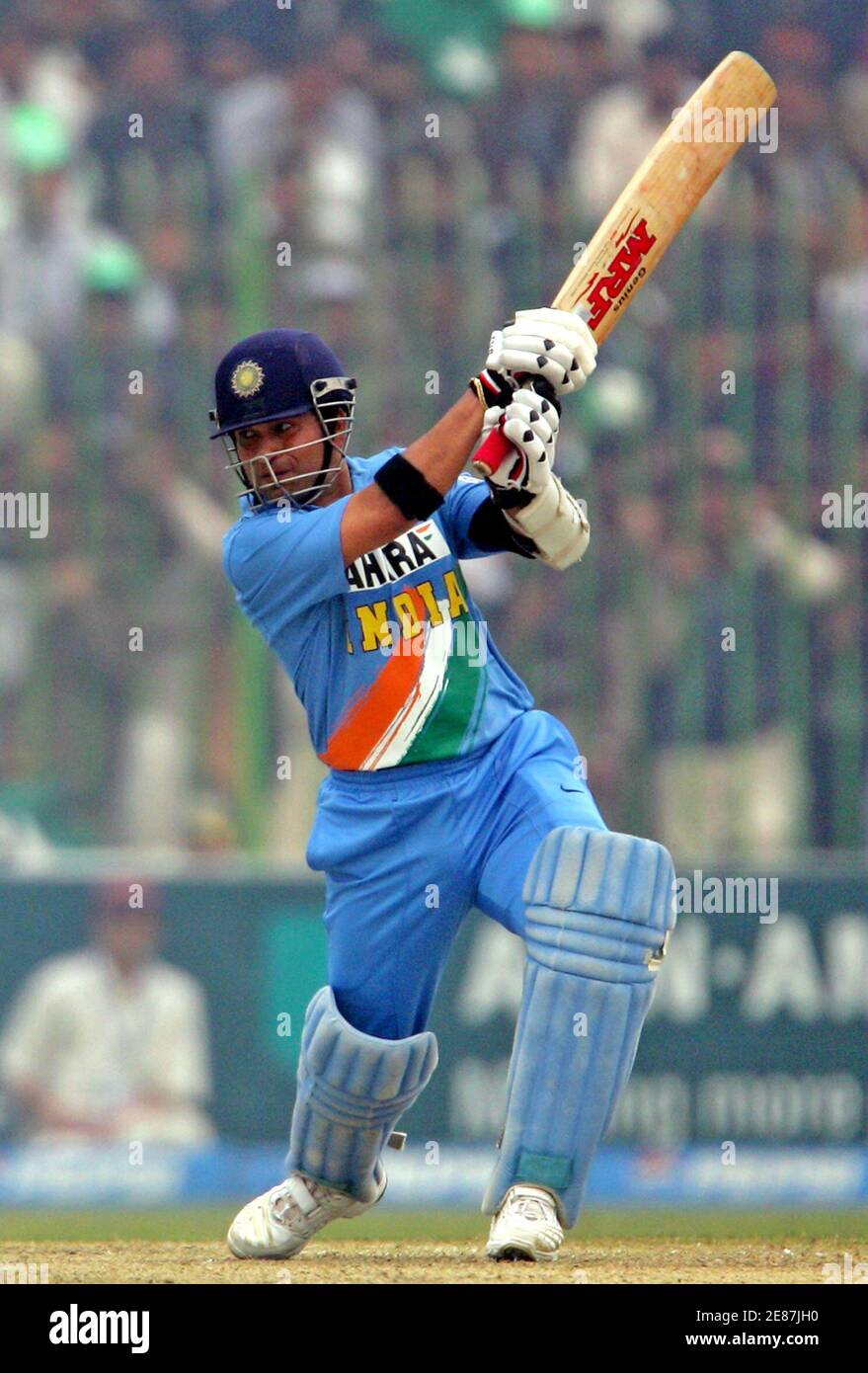 India's Sachin Tendulkar hits a shot in the first one-day international  cricket match between India and Pakistan in Peshawar February 6, 2006.  Tendulkar's 39th one-day international hundred led India to a huge