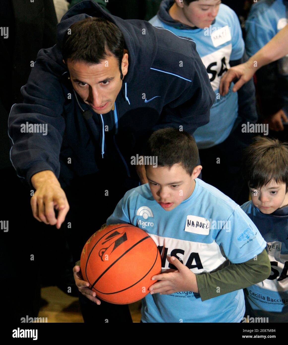 Argentine Basketball Player Manu Ginobili Who Plays For Nba Team San Antonio Spurs Gives Instructions To A Boy During A Sports Clinic He Gave For Mentally Handicapped Children In Buenos Aires July