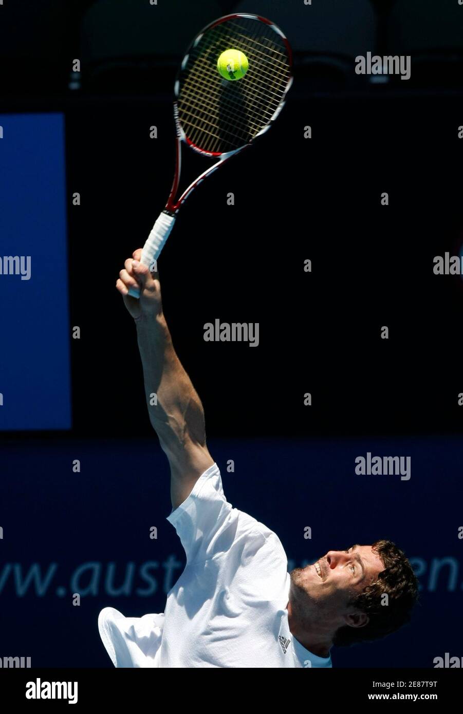 Russia's Marat Safin serves the ball at a tennis practice session at  Melbourne Park January 12, 2009. REUTERS/Mick Tsikas (AUSTRALIA Stock Photo  - Alamy