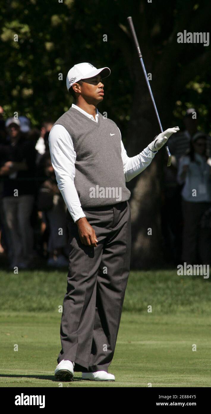 Tiger Woods tosses his club aside after hitting off of the fairway on the eighth hole during the third round of play at the Arnold Palmer Invitational golf tournament held at the Bay Hill Club in Orlando, Florida March 17, 2007. REUTERS/Rick Fowler (UNITED STATES) Stock Photo