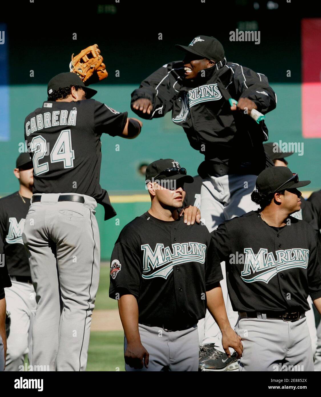 Florida Marlins starting pitcher Dontrelle Willis (top right) and teammate Miguel Cabrera (24) celebrate their win over the Washington Nationals after MLB baseball's Opening Day in Washington, April 2, 2007. Willis got the win, and Cabrera had four RBIs in the game.     REUTERS/Gary Cameron  (UNITED STATES) Stock Photo