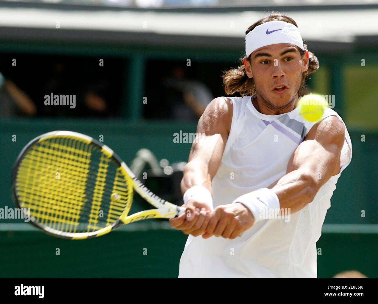 Spain's Rafael Nadal plays a return to Switzerland's Roger Federer during  the men's singles final at the Wimbledon tennis championships in London  July 8, 2007. REUTERS/Eddie Keogh (BRITAIN Stock Photo - Alamy
