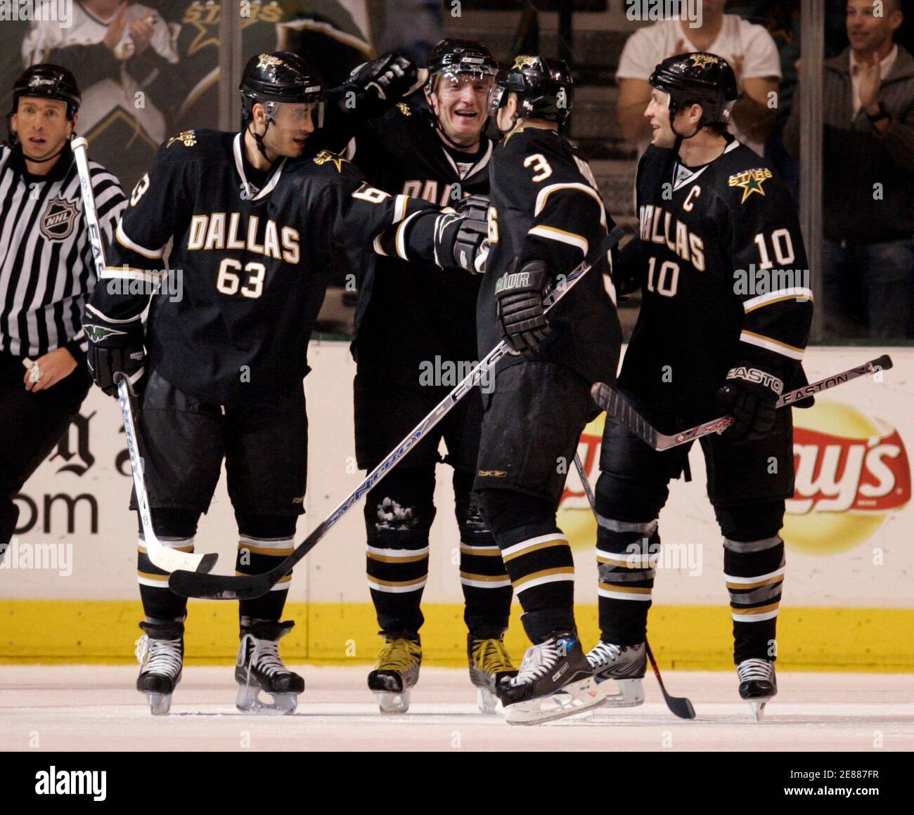 L to R) Dallas Stars center Mike Ribeiro, right wing Jere Lehtinen,  defenseman Stephane Robidas and left wing Brenden Morrow react to Lehtinen's  goal in the second period of their NHL hockey