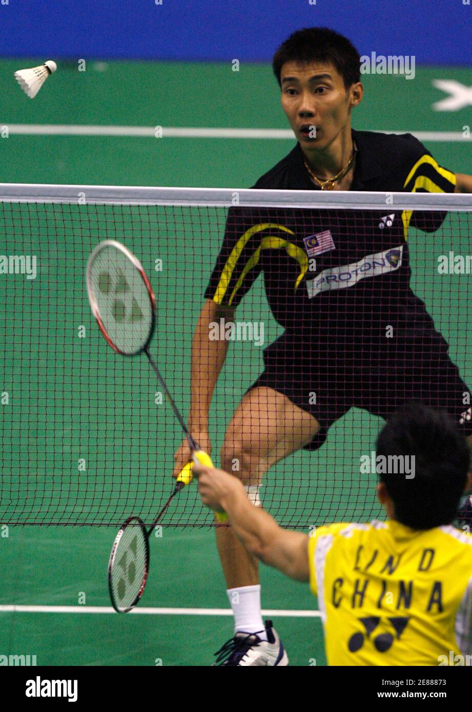 Malaysia's Lee Chong Wei (top) play a shot to China's Lin Dan during the semifinal of the Thomas Cup badminton championships in Jakarta May 16, 2008. REUTERS/Beawiharta (INDONESIA) Stock Photo