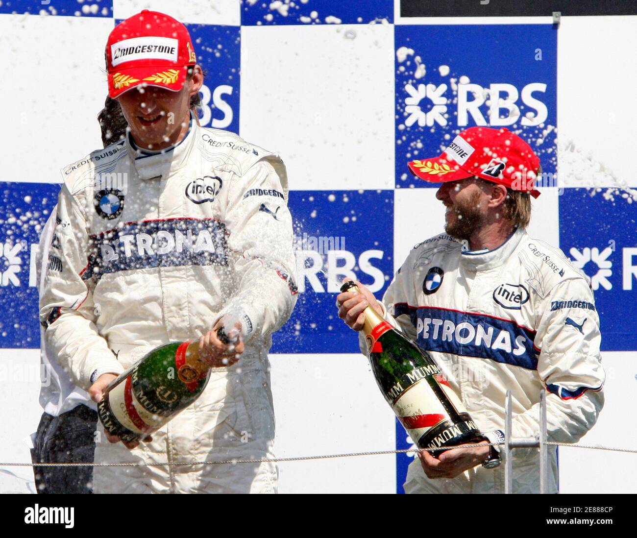 BMW Sauber Formula One driver Robert Kubica (L) of Poland celebrates his win with teammate Nick Heidfeld (R) of Germany at the Canadian F1 Grand Prix in Montreal June 8, 2008. Heidfeld finished second.     REUTERS/Chris Wattie (CANADA) Stock Photo
