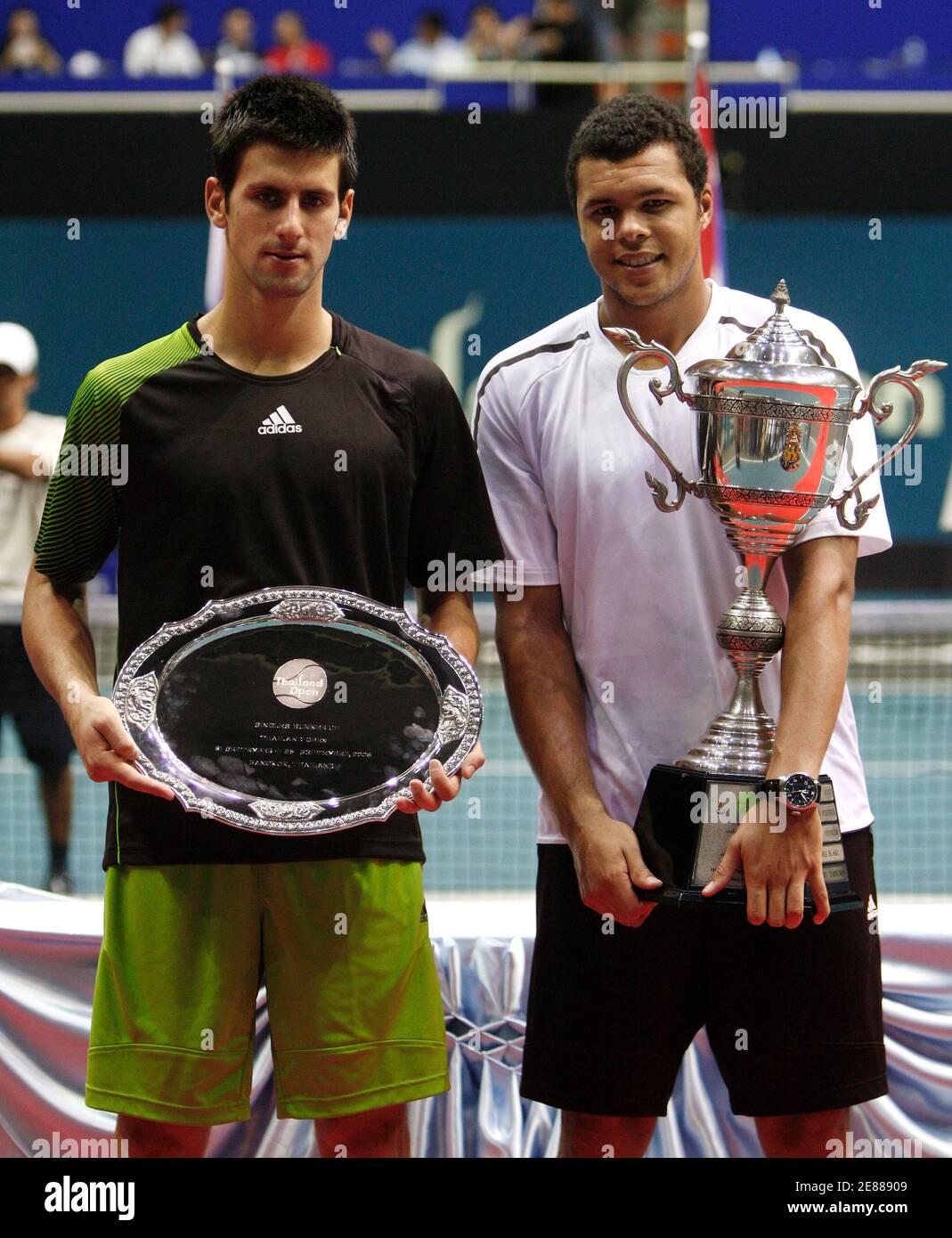 Jo-Wilfried Tsonga of France (R) and Novak Djokovic of Serbia pose after  their final tennis match at the Thailand Open 2008 in Bangkok September 28,  2008. Tsonga won the match. REUTERS/Chaiwat Subprasom (