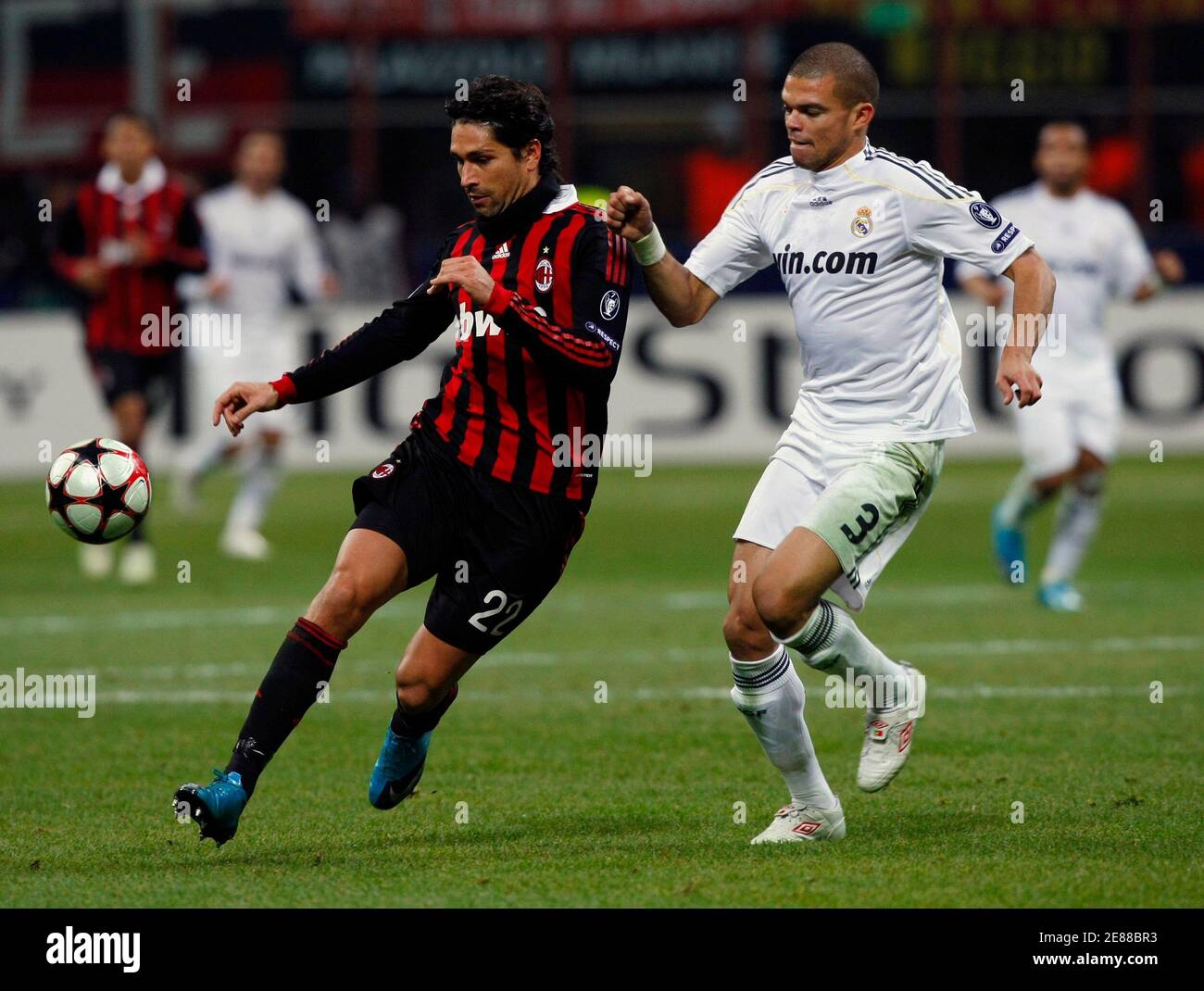 AC Milan's Marco Borriello (L) challenges Pepe of Real Madrid during their  Champions League soccer match at the San Siro stddium in Milan November 3,  2009. REUTERS/Alessandro Bianchi (ITALY SPORT SOCCER Stock