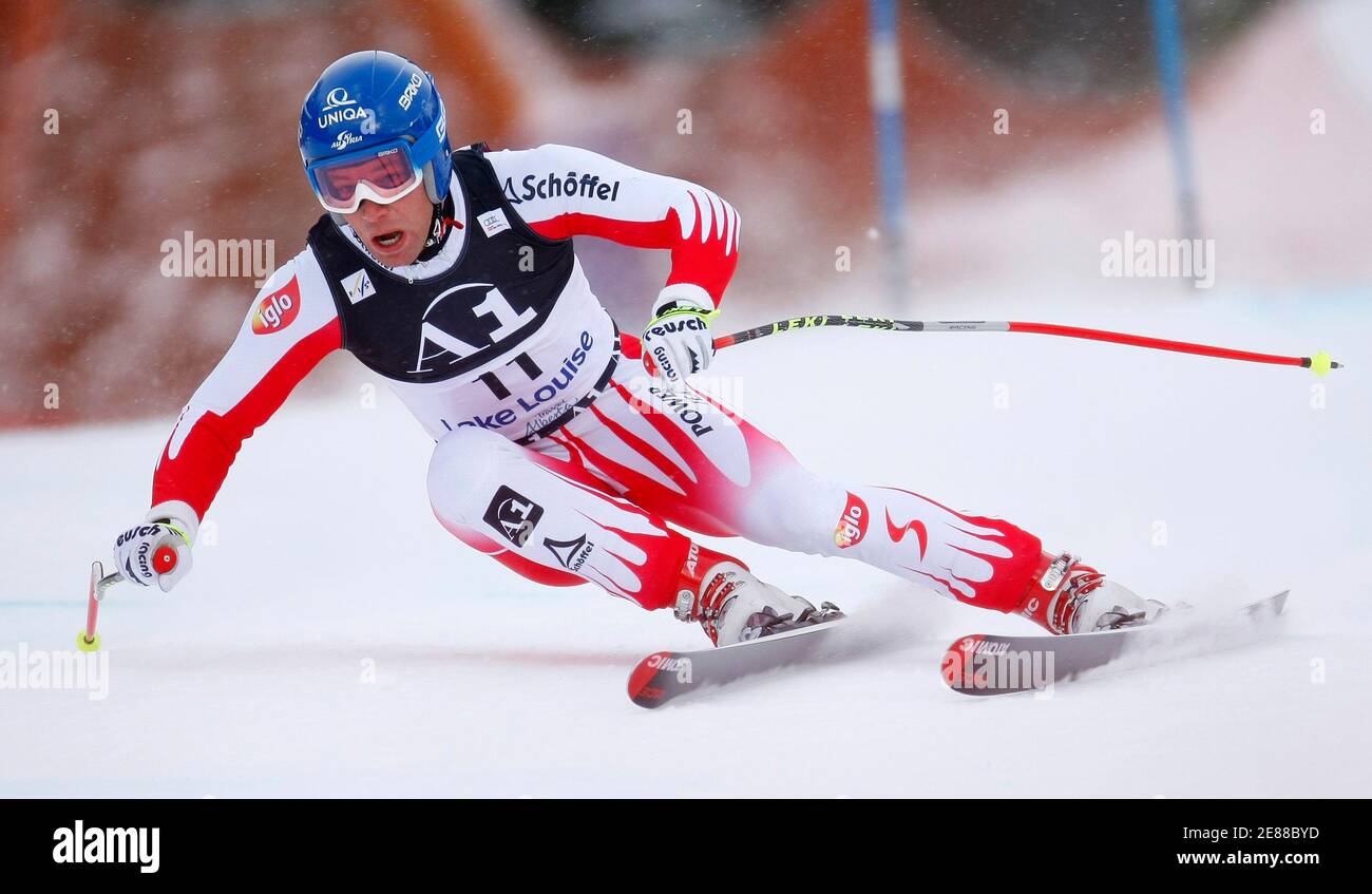 Benjamin Raich of Austria speeds down the mountian during the men's World Cup super-g alpine skiing race in Lake Louise, Alberta, November 29, 2009.     REUTERS/Mike Blake (CANADA SPORT SKIING) Stock Photo