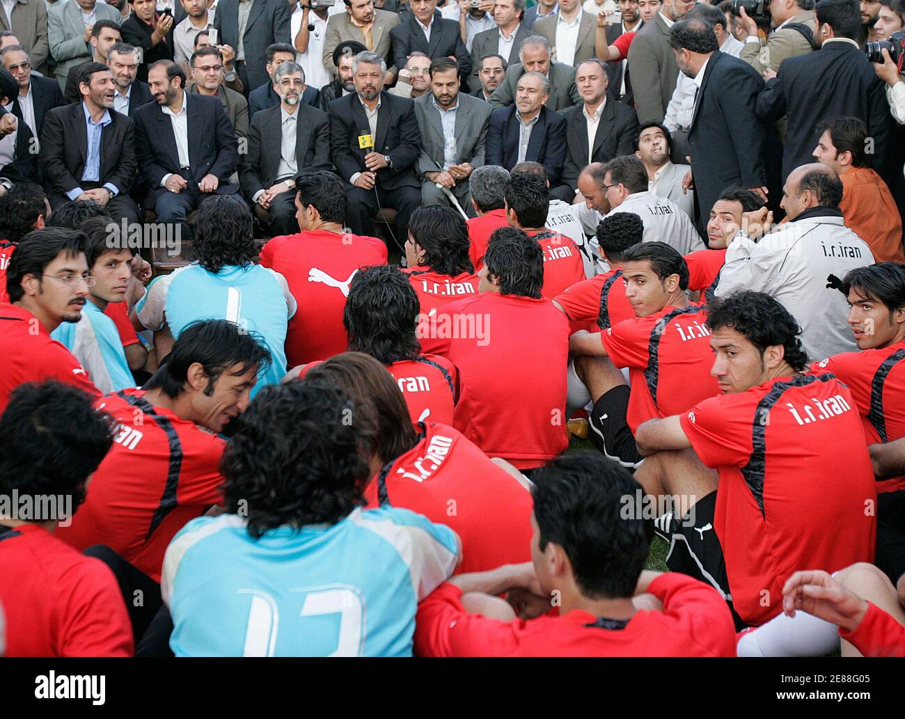 Iran's parliament speaker Gholamali Haddadadel (3rd L) accompanied by unidentified officials from the physical education department meets the members of Iran's World Cup team during a practice session at Azadi sport complex in Tehran, Iran May 23, 2006.   REUTERS/Raheb Homavandi Stock Photo