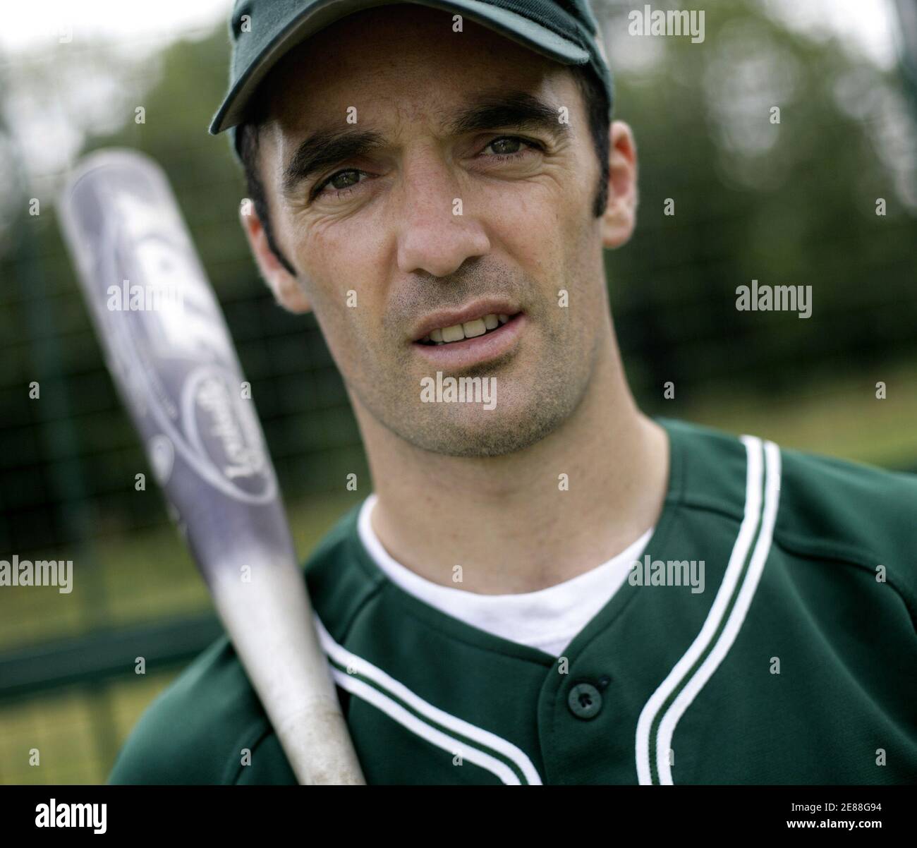 Ireland's baseball team captain John Dillon poses for a photograph at  Corkagh Park, Dublin, Ireland July 22, 2006. Ireland's national team are  not only gunning for a place in the European premier