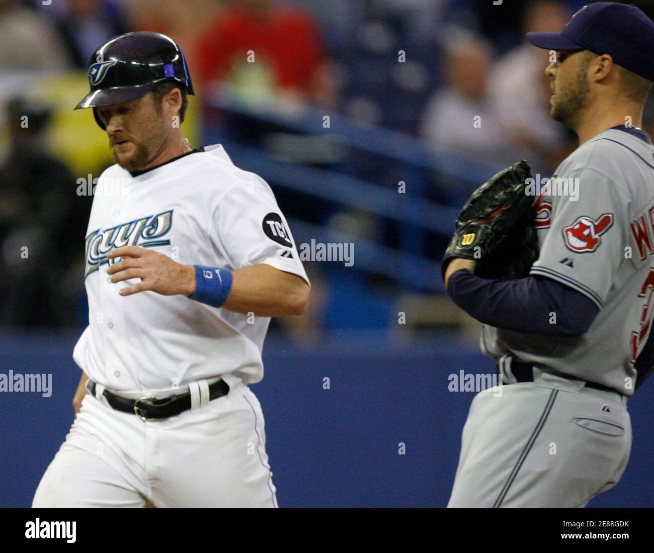 Toronto Blue Jays Gregg Zaun L Scores What Proved To Be The Winning Run On A Wild Pitch By Cleveland Indians Pitcher Jake Westbrook R During The Second Inning Of Their American