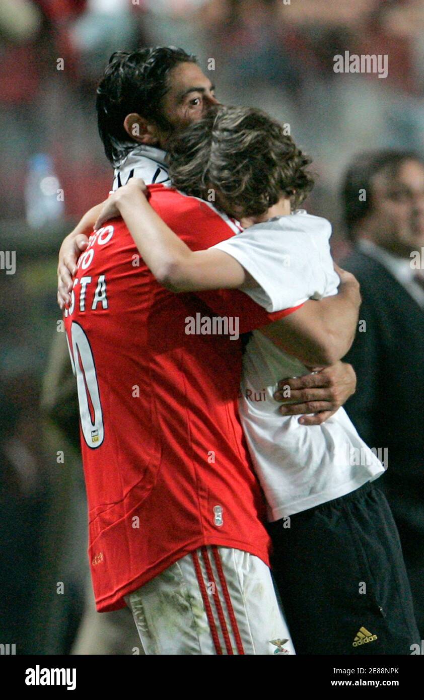 Benfica's Rui Costa hugs his son after their Portuguese Premier League  soccer match against Setubal at Luz stadium in Lisbon May 11, 2008. It was  Costa's last match in his career as