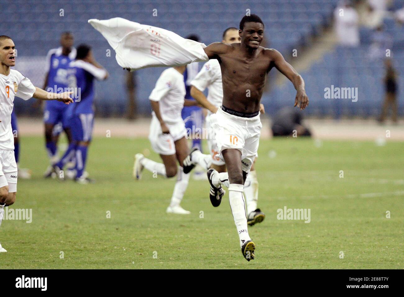 Qatar's Umm Salal player Ibrahhim Inday reacts after they won their match against Saudi's Al Hilal during their AFC Champions League soccer match at King Fahad stadium, in Riyadh  May 26, 2009.   REUTERS/Fahad Shadeed (SAUDI ARABIA SPORT SOCCER) Stock Photo