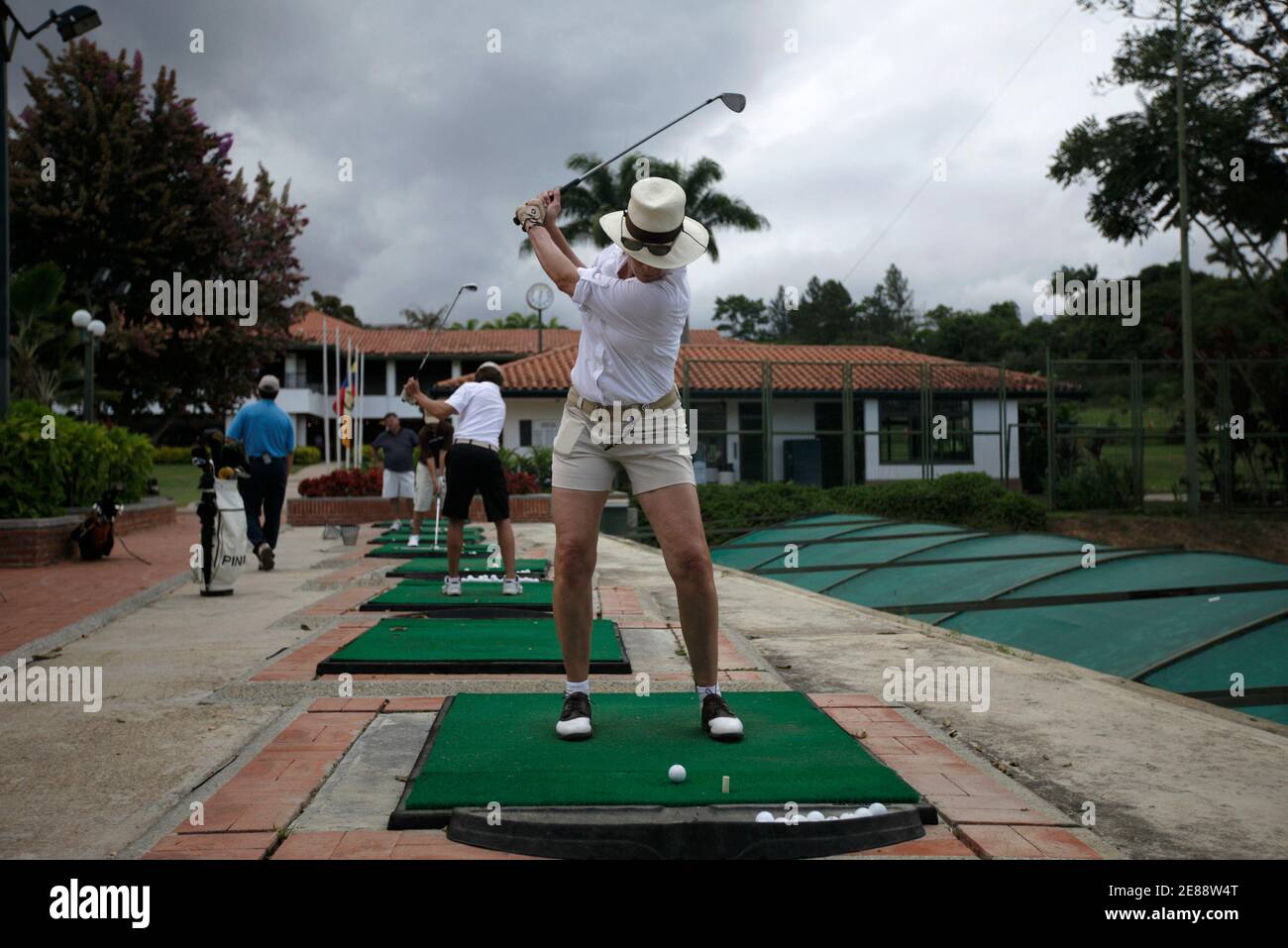 A woman practices golf at Lagunita Country Club in Caracas September 13,  2009. Venezuela's socialist President Hugo Chavez recently openly expressed  his disgust for the 