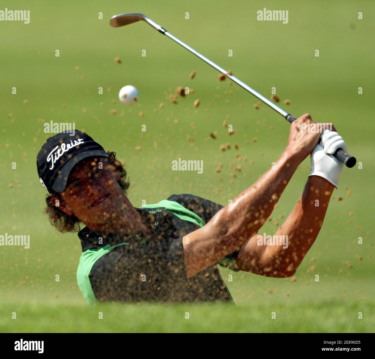 Australia's Adam Scott plays a shot at the 16th hole during the second round of the $4 million Sun City Golf Challenge in Sun City, west of Johannesburg, in South Africa December 2, 2005. Scott finished at three under-par. REUTERS/Juda Ngwenya Stock Photo
