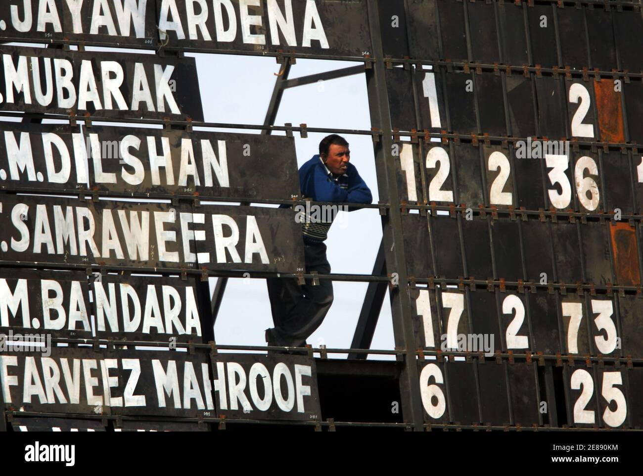 A Score Keeper Looks At The Match Through A Scoreboard During The Fourth Day S Play Of The Third And Final Cricket Test Match Between India And Sri Lanka In Ahmedabad December 21 A Score Keeper Looks At The Match Through A Scoreboard During The Fourth Day S Play Of The Third And Final Cricket Test Match Between India And Sri Lanka In Ahmedabad December 21