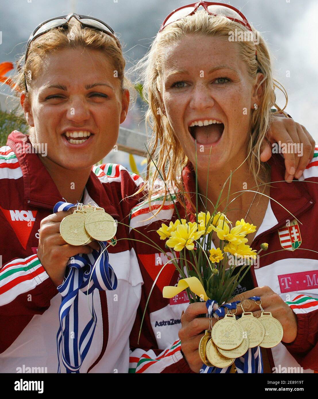 Katalin Kovacs and Natasa Janics of Hungary show off the gold medals they gained during the European Flatwater Championships in the central Bohemian village of Racice, Czech Republic, July 9, 2006.                REUTERS/Petr Josek   (CZECH REPUBLIC) Stock Photo